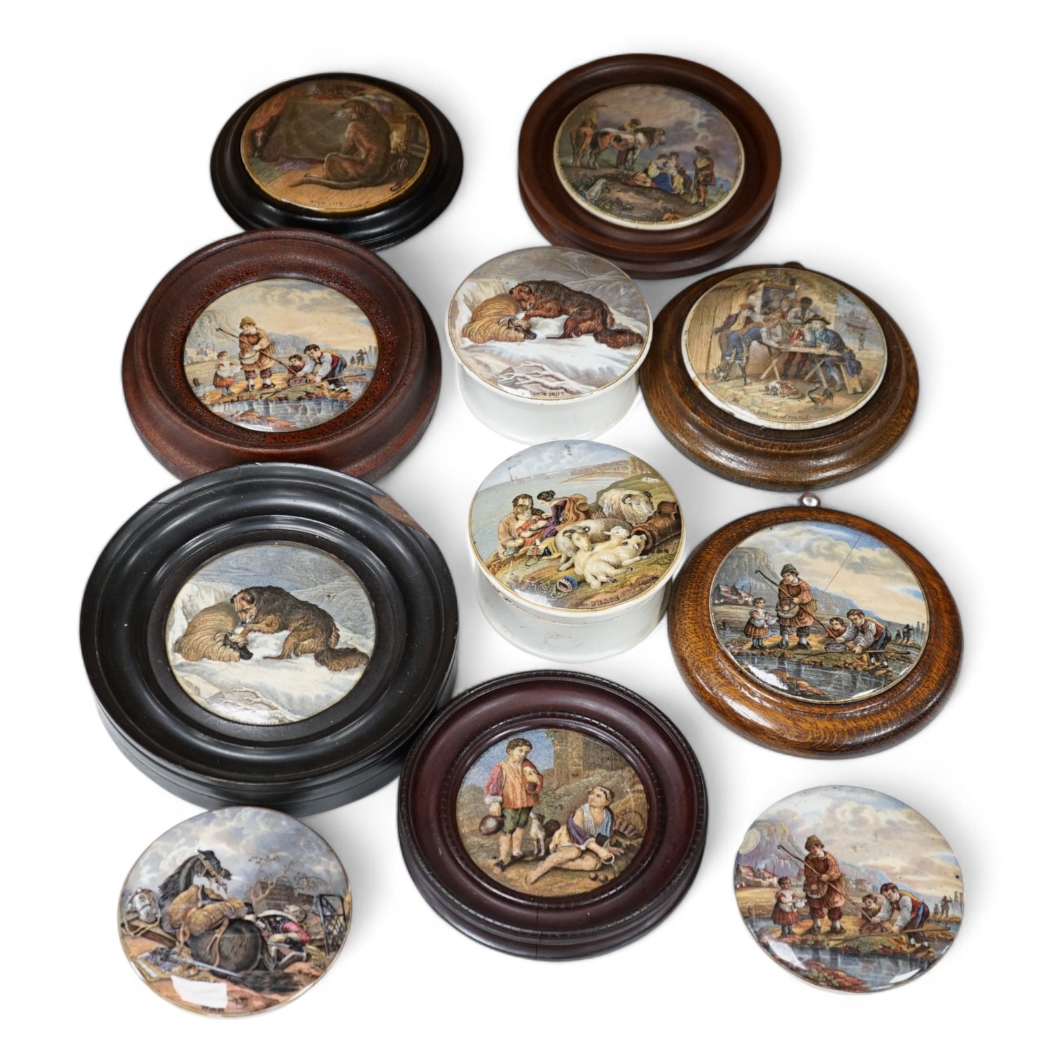 Eleven 19th century mostly framed pot lids including ‘The Snow Drift’, ‘War’, ‘High Life’, etc. Condition - mostly good, one cracked